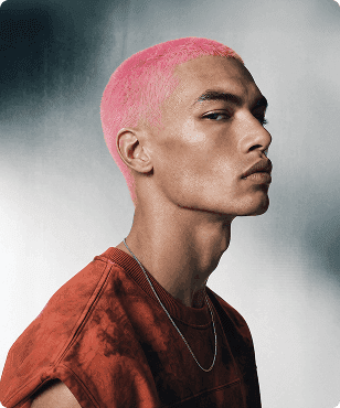 Portrait of a man with short pink hair