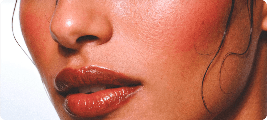 Close-up of glossy red lips