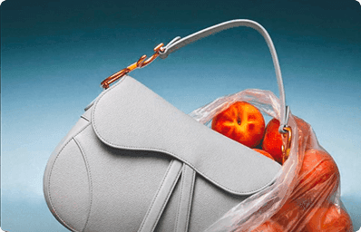 Grey saddle bag filled with peaches